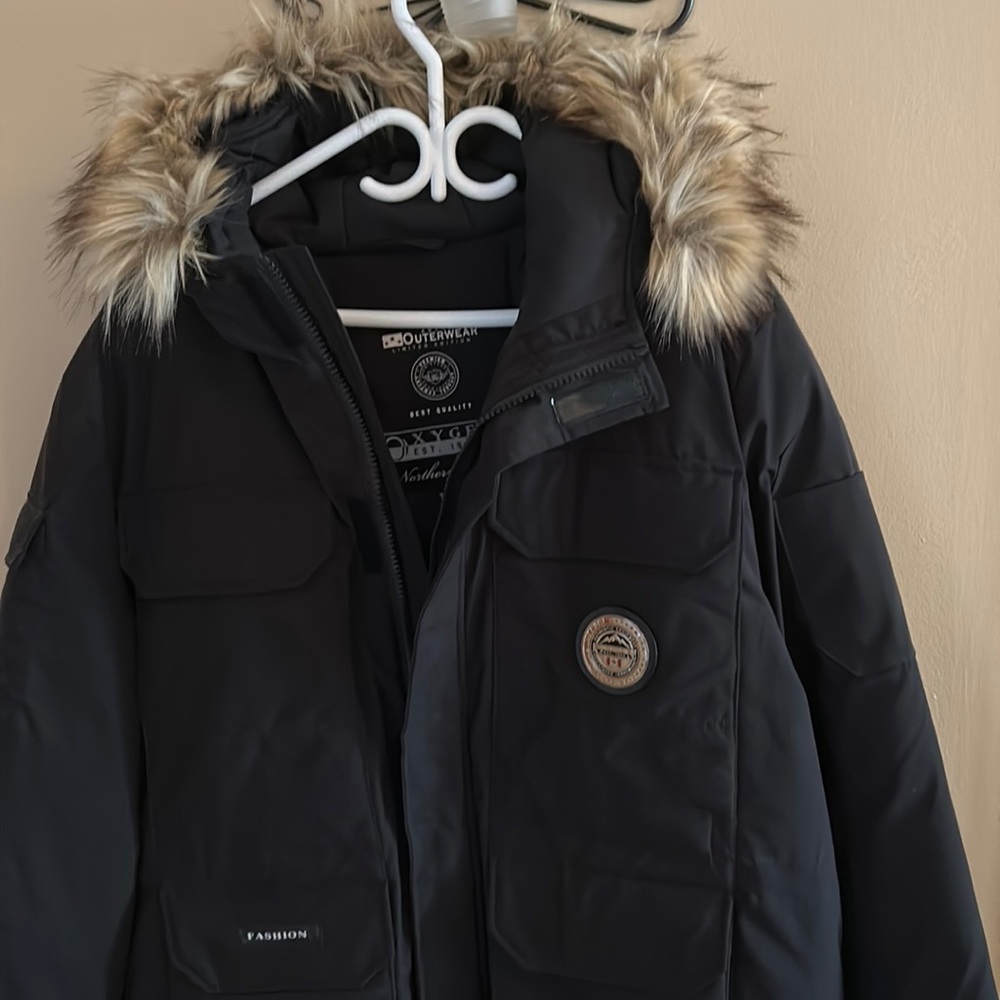 A very warm winter coat with a real fur hood.